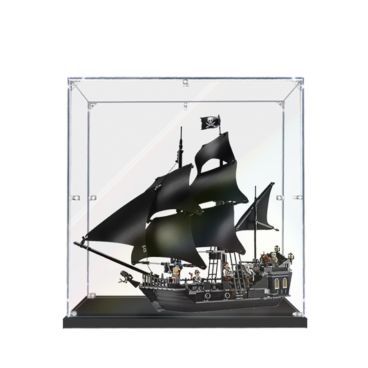 A clear acrylic display case showcasing a LEGO Pirates of the Caribbean: The Black Pearl 4184 set.