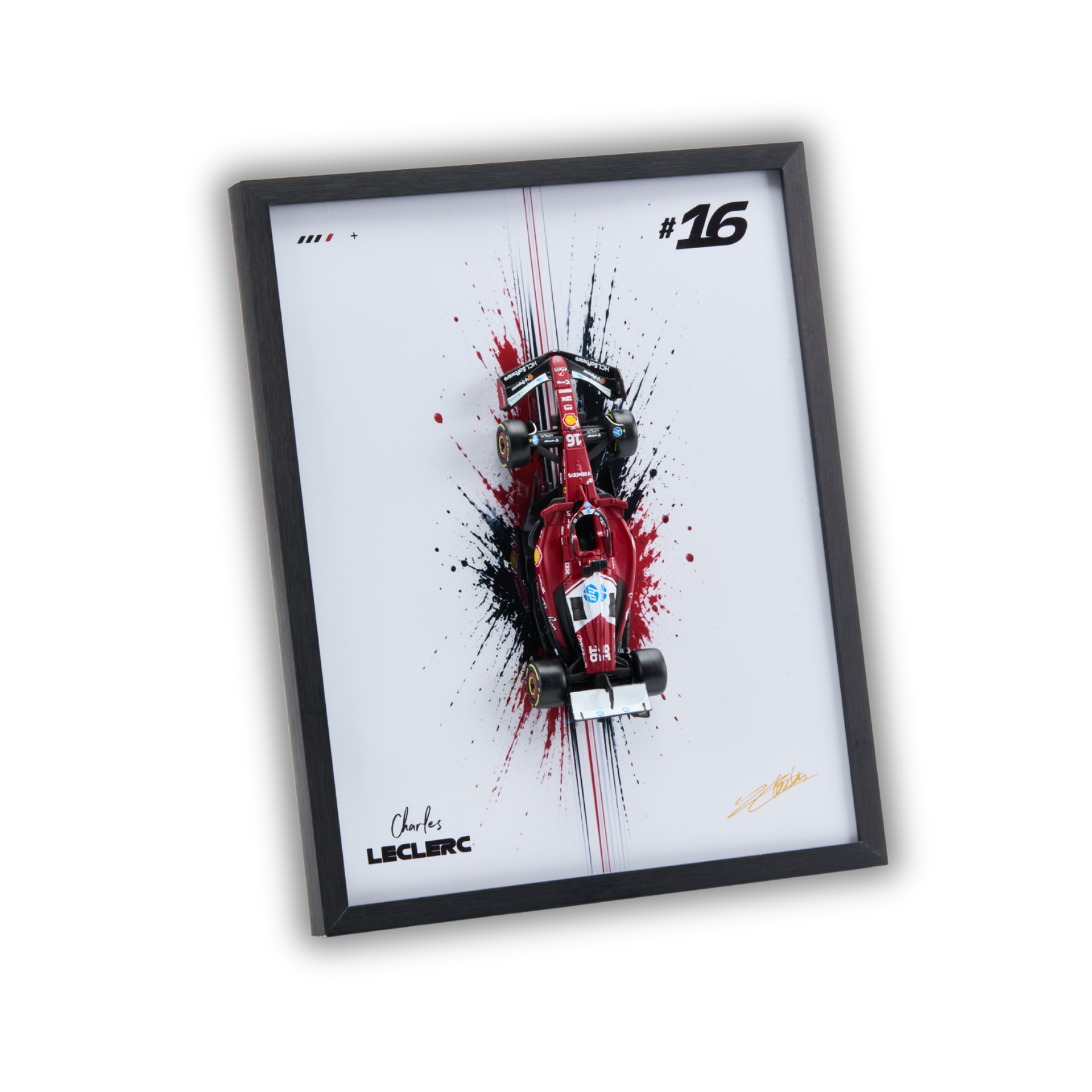 A framed art print featuring a red Formula 1 race car with black and red paint splatters on a white background, enclosed in a black frame. The print includes the number 16, the name Charles Leclerc, and a signature.