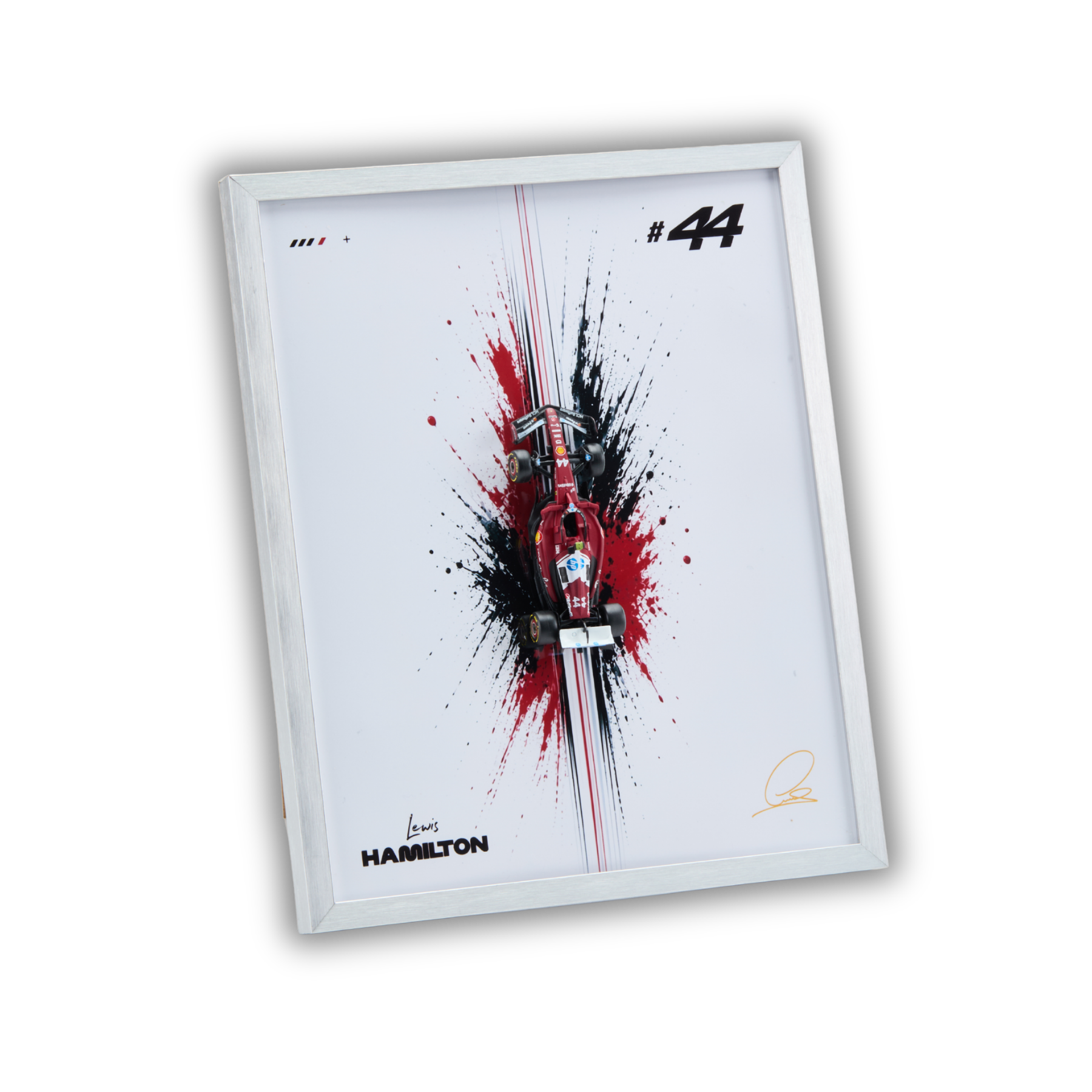 A framed art print featuring a stylized red and black Formula 1 car splash design on a white background, with the number 44, Hamilton branding, and a silver frame, shown on a plain white background.
