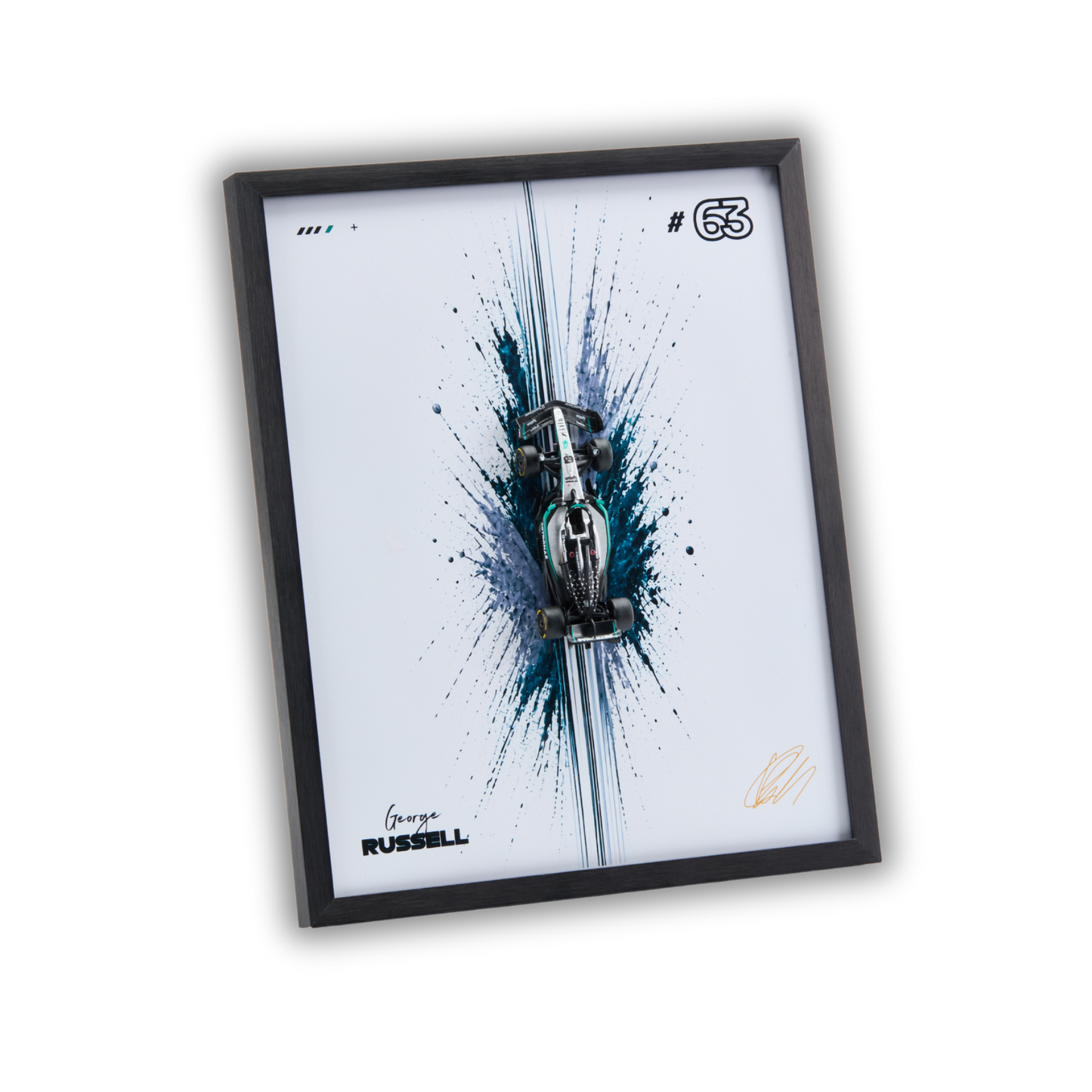 A framed wall art print featuring a stylized silver race car over a blue and black paint splatter design on a white background, with the text 'George RUSSELL' and number '63' visible. The print is housed in a slim black frame and shown at an angle against a plain white background.
