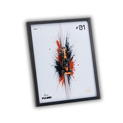 A framed art print featuring a stylized orange and black Formula 1 car centered over a white background with red and black paint splatters, a black frame, and the text '#81' plus a signature. The frame is shown at an angle on a plain white background.